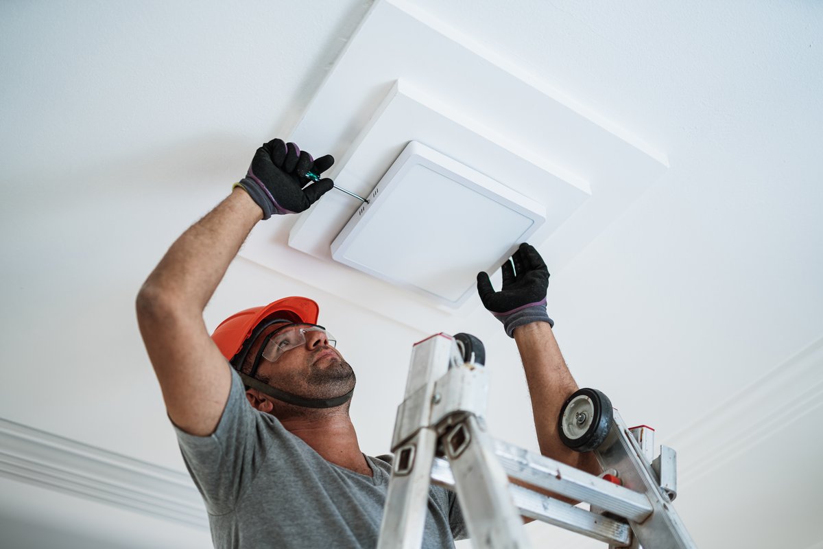 Electrician installing equipment in Lancaster CA
